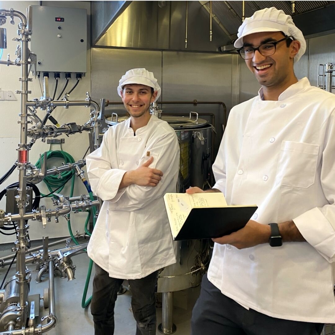 Chas Newman (Left) and Kuran Malhotra (Right) working at the Compass Simple Syrups Brewing Pod in Union Kitchen